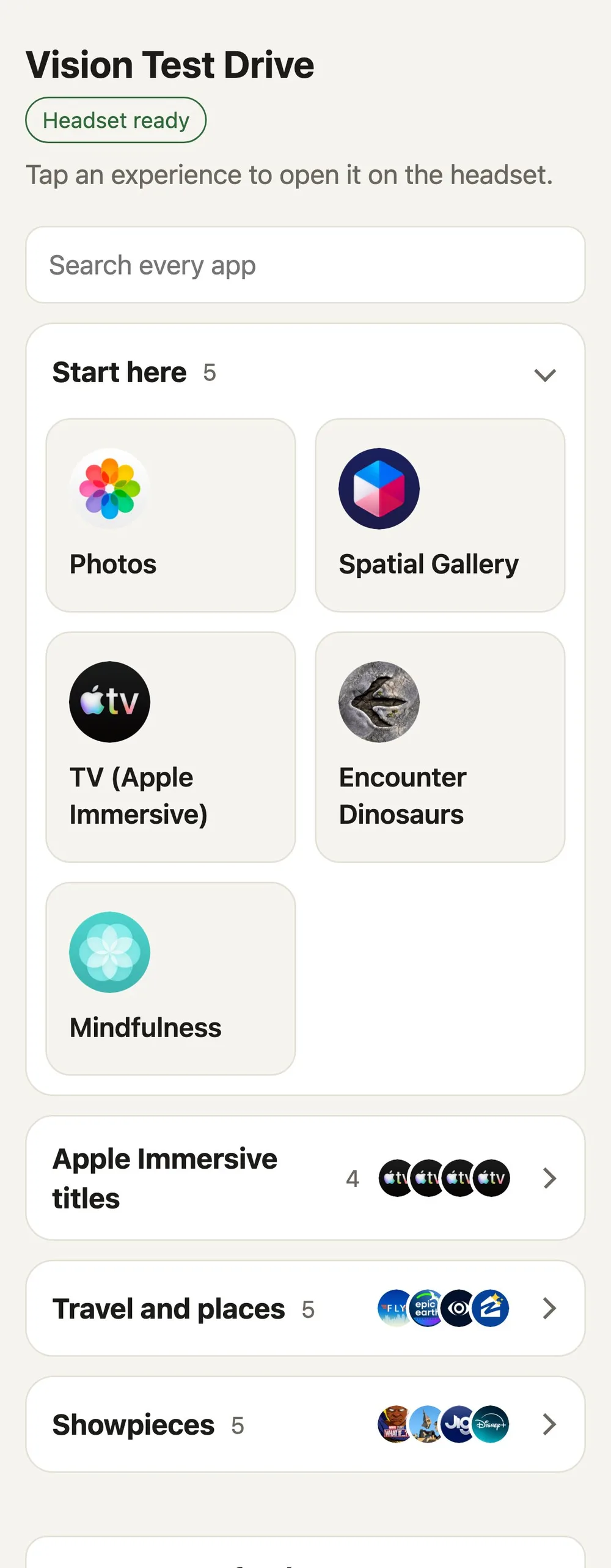 The Vision Test Drive remote on an iPhone showing a Headset ready badge, a search box, and a Start here folder with Photos, Spatial Gallery, TV, Encounter Dinosaurs, and Mindfulness tiles
